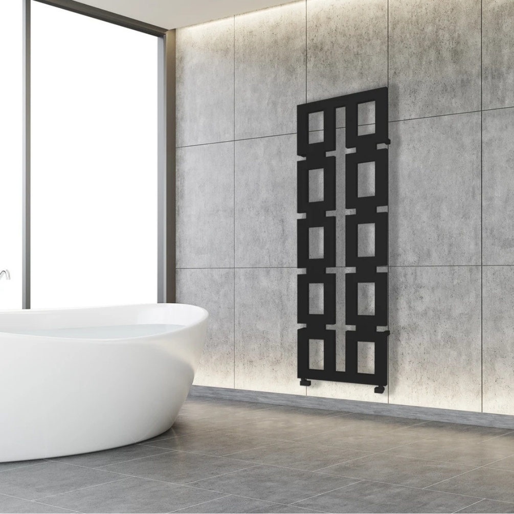 Lifestyle image of the Radox Inka 1700mm x 580mm Matt Black Designer Heated Radiator mounted on a white bathroom wall, near a freestanding bath